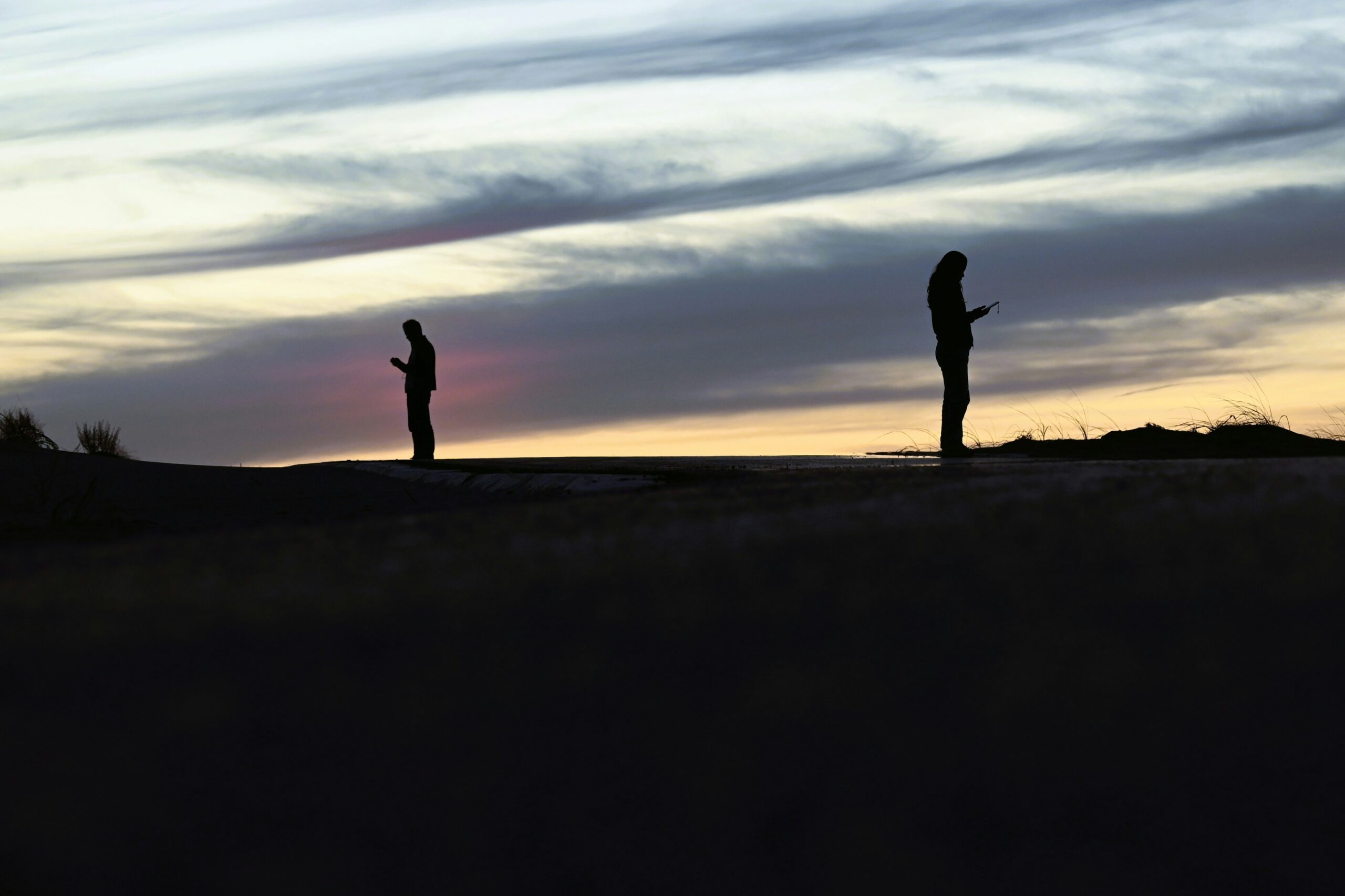 two people standing at a distance