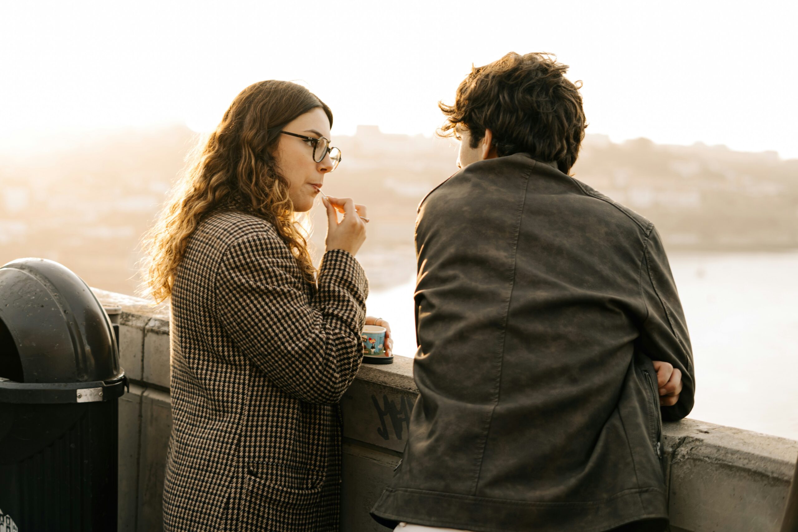 couple having a deep conversation near the sea